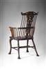An extremely rare 18th century comb-back armchair.
