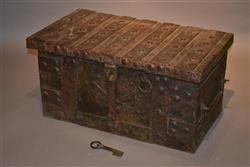 A 15th/16th century oak and iron strongbox.