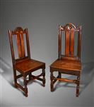 A pair of late 17th century oak chairs.