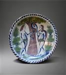 A Bristol delft Adam and Eve charger.