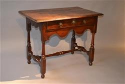 A Queen Anne fruitwood side table.
