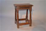 A Charles II oak joint stool.