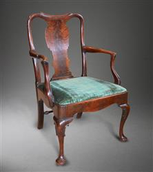 An early George II walnut armchair.