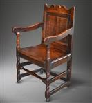 A late 17th century oak armchair.