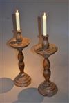 A pair of 16th/17th century oak candlesticks.