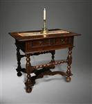 A Charles II oak side table.