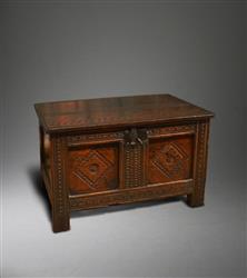 An exceptionally small mid 17th century oak chest.