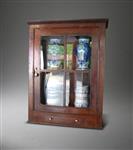 A small Geroge III oak glazed cabinet.