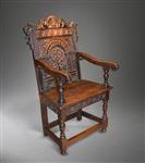 A late Elizabethan oak armchair.