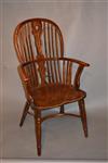 A George III yew wood Windsor armchair.