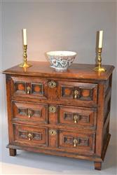 A very small 17th century oak chest of drawers.
