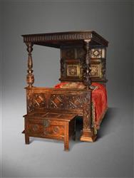 A 17th century and later oak full tester bed.