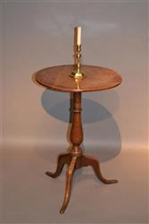 A George III walnut and oak candle stand.