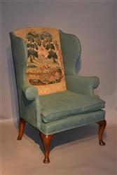 A George II wing armchair. 