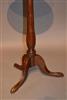 A mid 18th century oak candlestand.