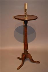 A mid 18th century oak candlestand.