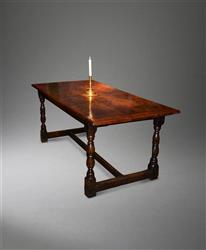 A 17th century yew and oak refectory table.