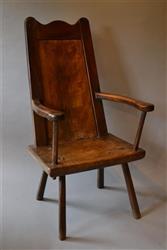 A substantial 18th century primitive armchair.