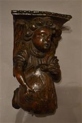 An Elizabethan angel carved with merchant's marks.