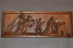 A very fine walnut depiction of The Annunciation.