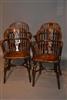 A matched set of eight yew wood Windsor armchairs.
