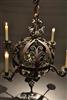 An 18th century wrought iron chandelier.