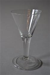 A large mid 18th century English wine glass.
