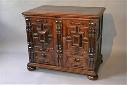A Charles II oak enclosed chest of drawers.