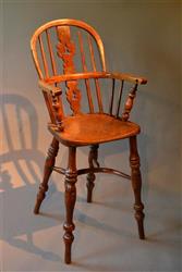 A Nottinghamshire yew wood child's high chair.