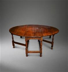 An eight seater oak gateleg table. 