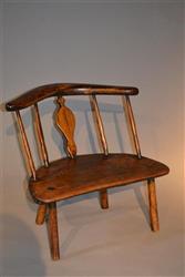 A very unusual George III primitive chair.