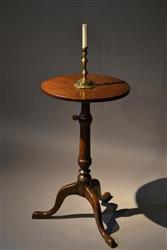 A Georgian adjustable height oak candle stand.