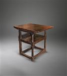  A 17th century oak chair table.