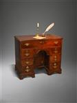 An early 18th century oak kneehole desk.