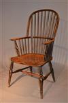 An early 19th century stick back Windsor armchair.