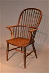 An ealry 19th century stick back Windsor armchair.