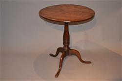 A George III elm tripod table.