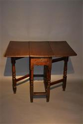 A very small Queen Anne oak gateleg table.
