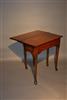 A very small George III oak dropleaf table.