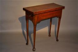 A very small George III oak dropleaf table.
