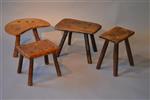 A collection of four primitive stools.