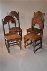 A matched set of four 17th century oak backstools.