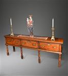 An early 18th century fruitwood low dresser.