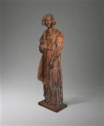 An early 16th century life size carved oak figure.