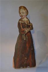 A dummy board of a girl holding a spaniel.