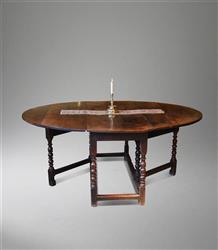 An eight seater Charles II oak gateleg table.