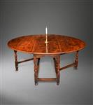 A Queen Anne elm gateleg table..