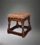 A rare late Elizabethan oak upholstered stool.  