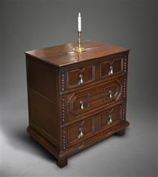 A very small Charles II oak chest of drawers.