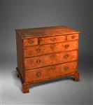 A George II burr elm chest of drawers.